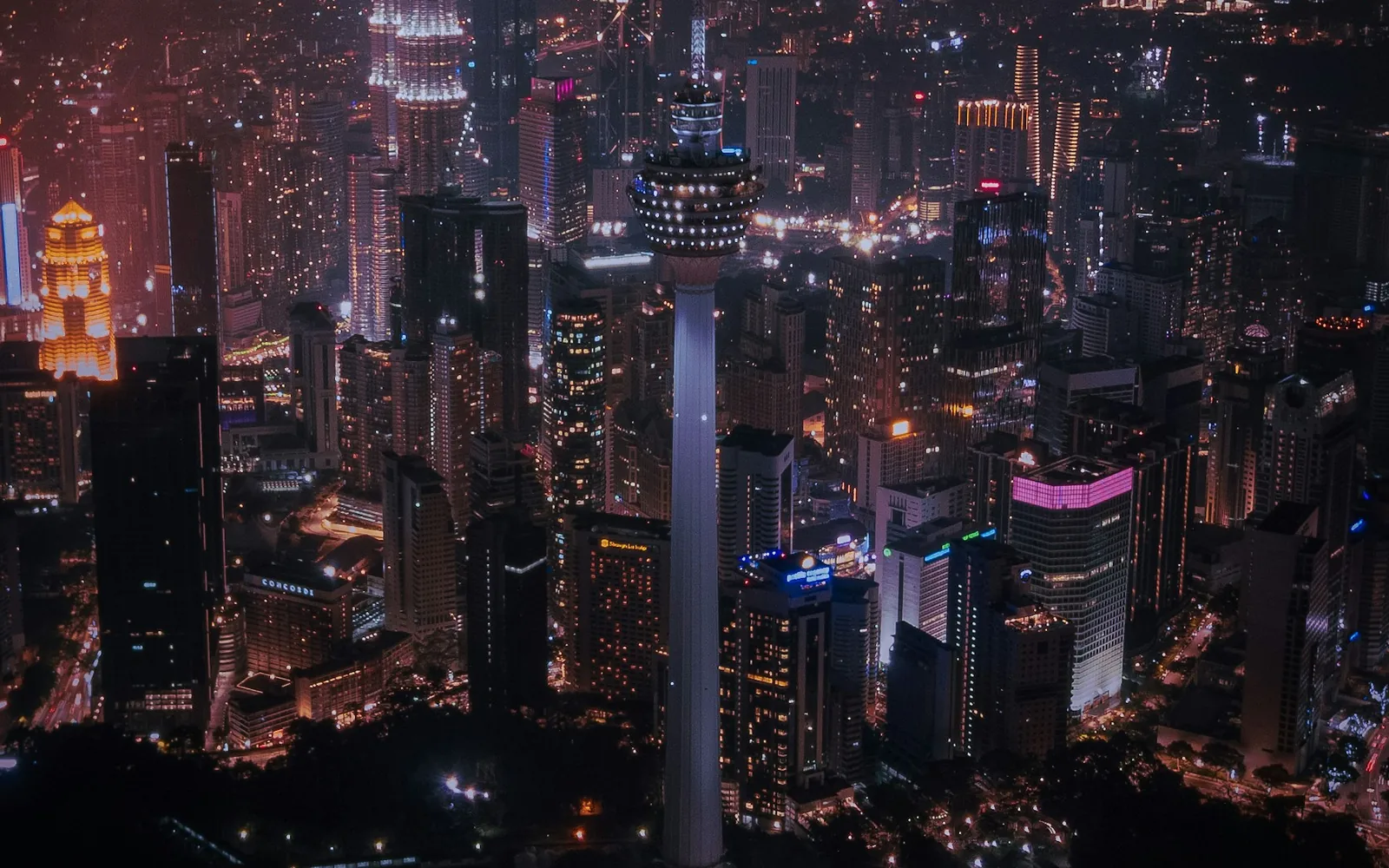 Kuala Lumpur cityscape with KL Tower and the Petronas Towers.